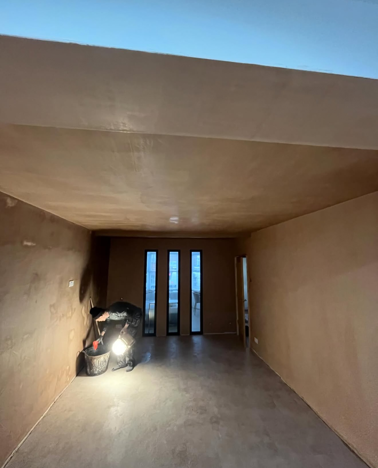 Long plastered room with a smooth ceiling