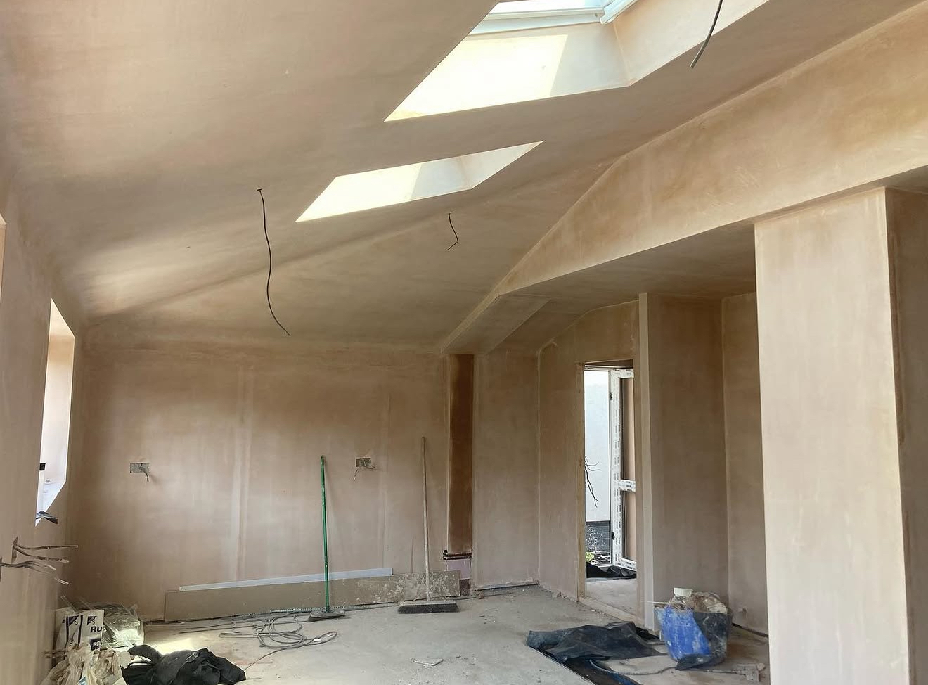 Extension walls and ceiling being plastered