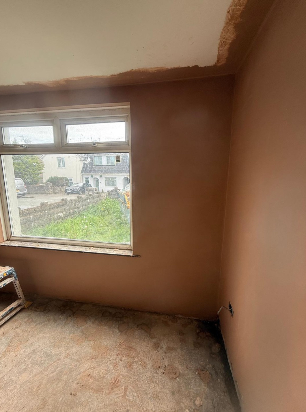 Plastered walls around a window