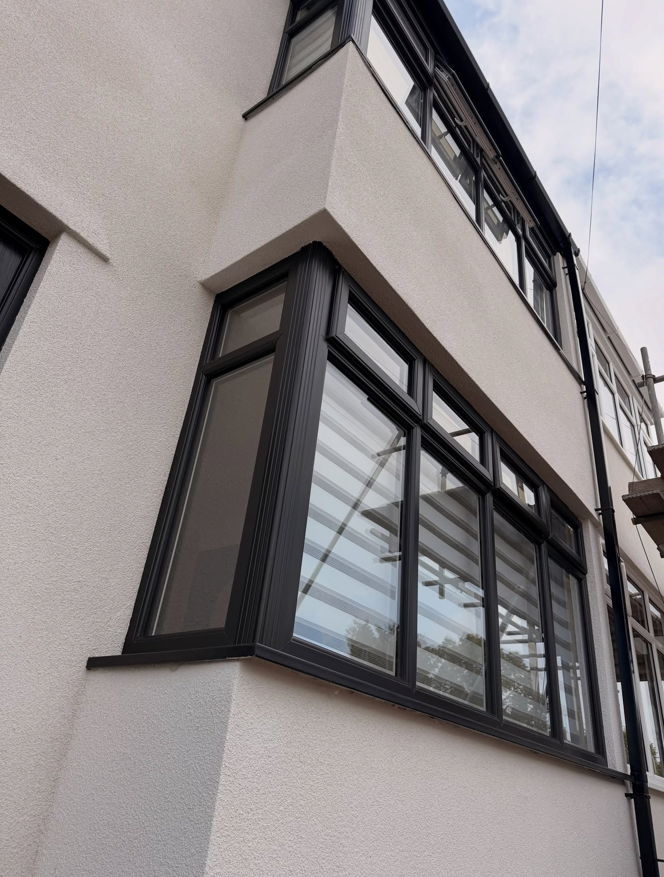 Close-up of render around a bay window