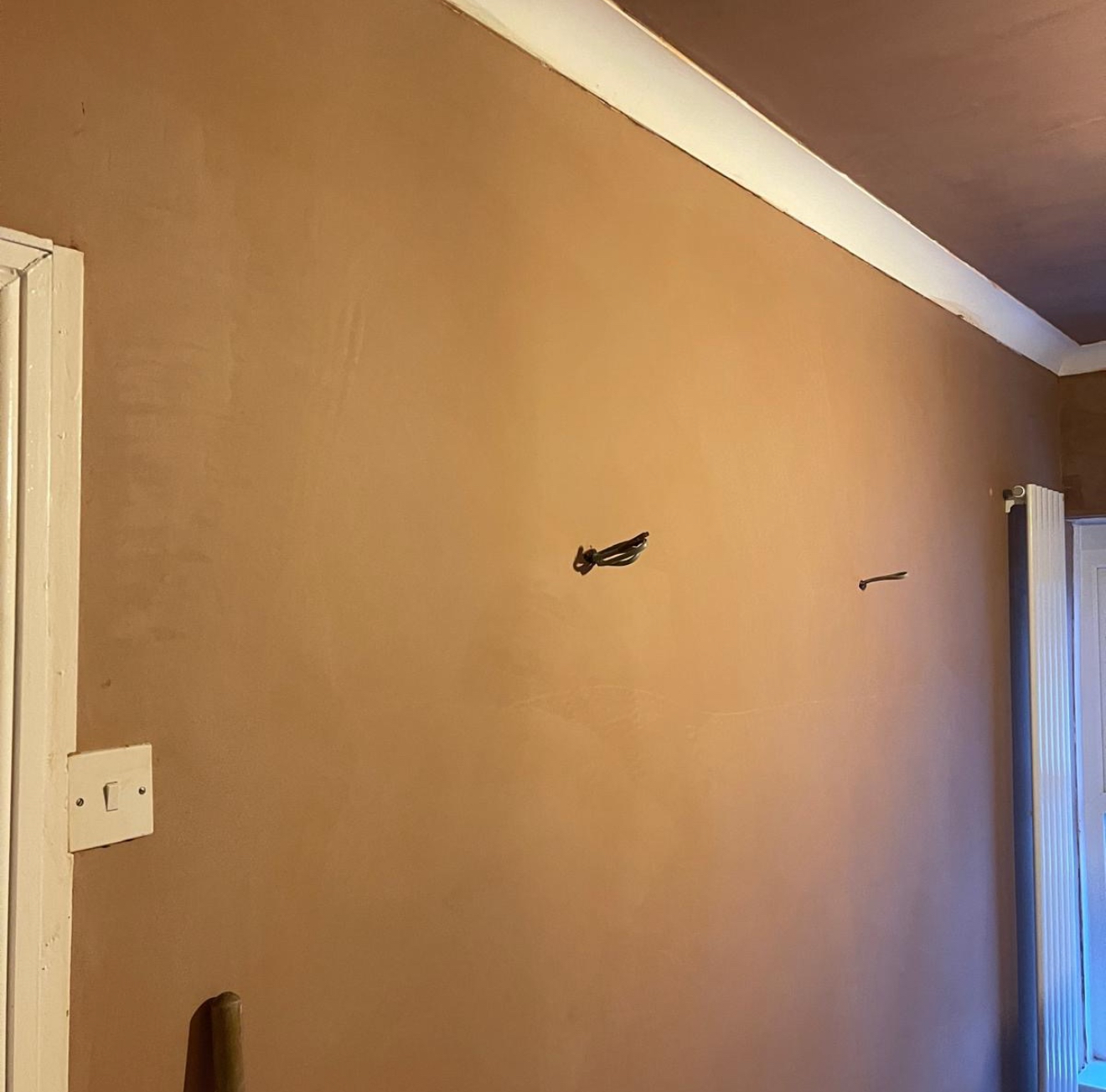 Tall freshly plastered wall
