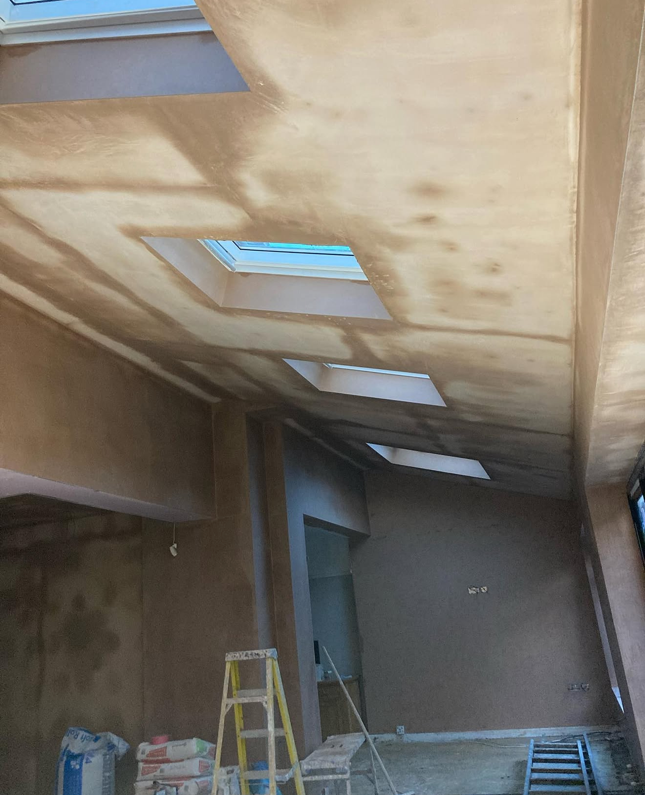 Plastered ceiling with roof windows