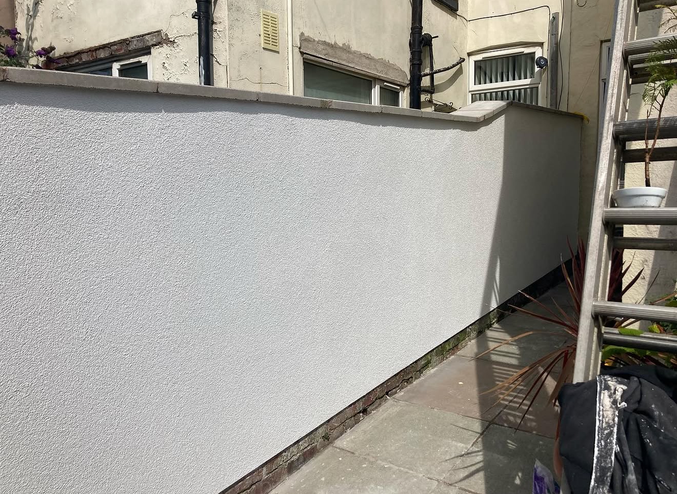 Smooth rendered garden wall