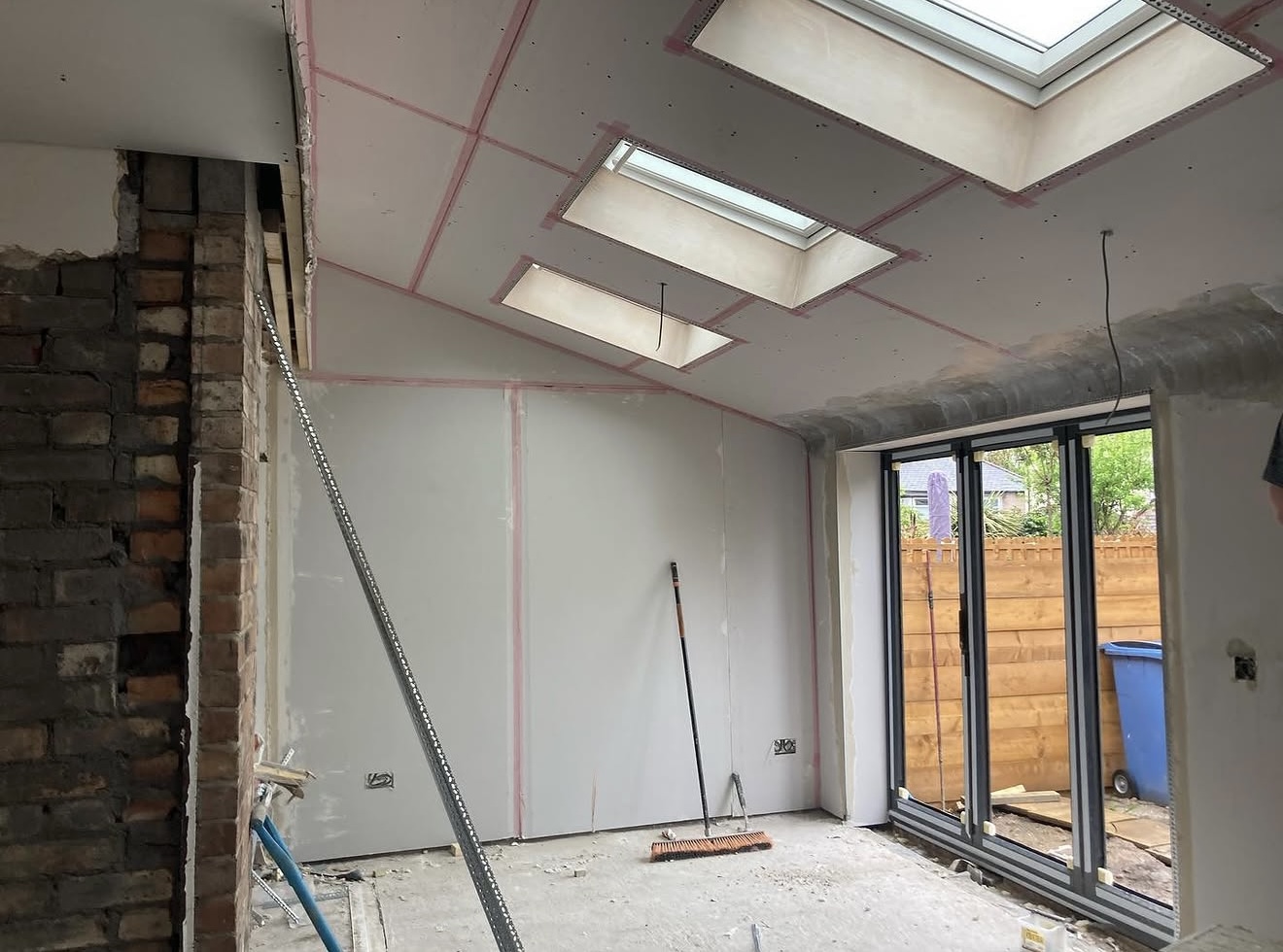 Boarded extension ceiling with roof windows